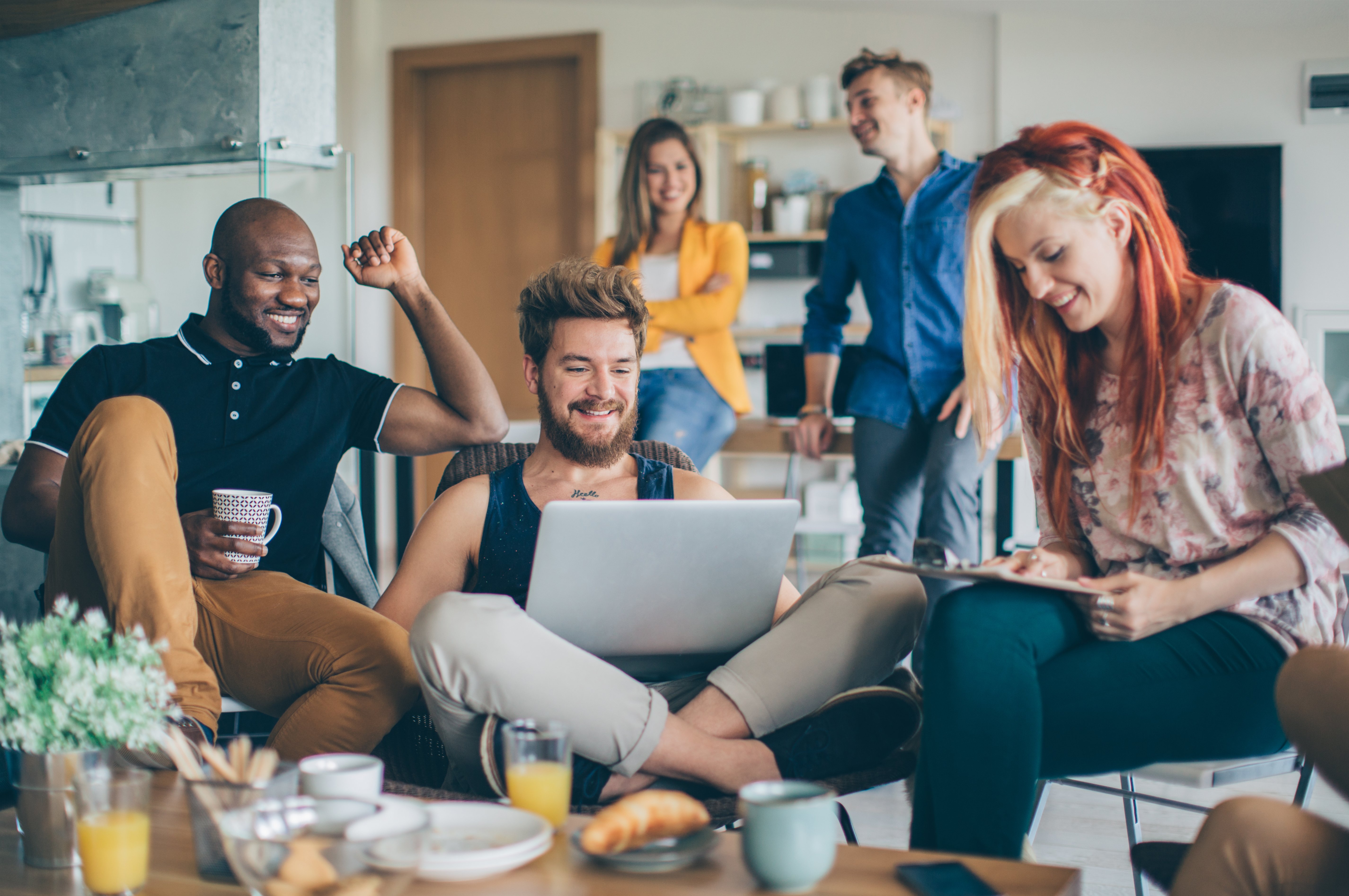 People getting together looking at a computer