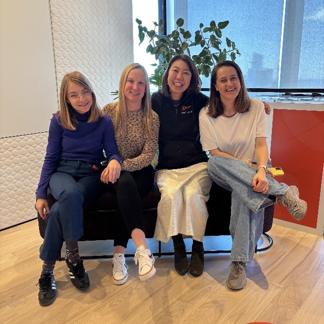 4 people sitting on a couch