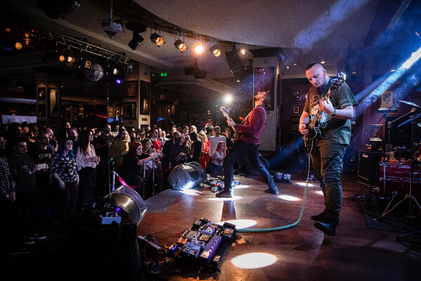 a photo of a band performing on stage