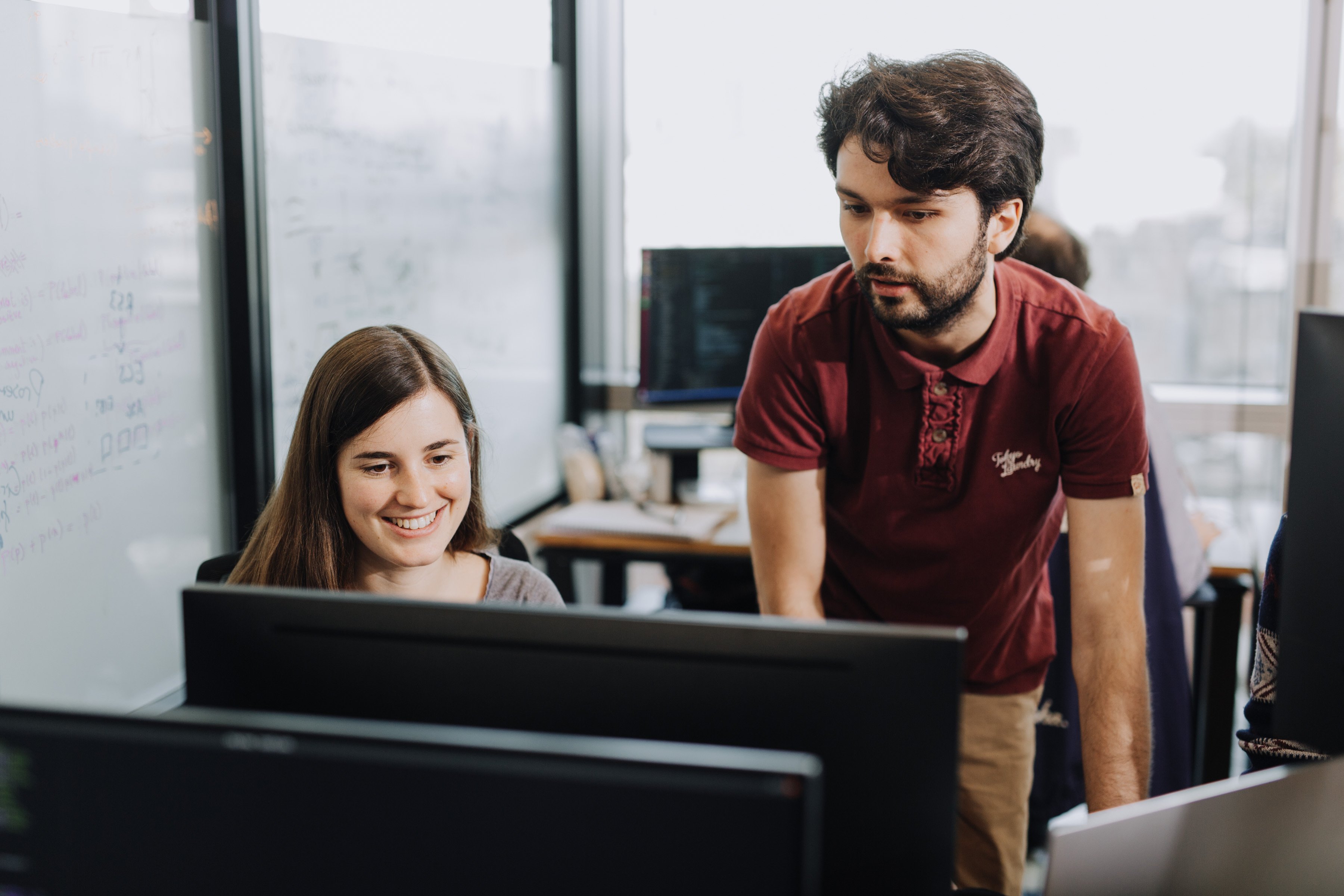 a photo of two colleague working together