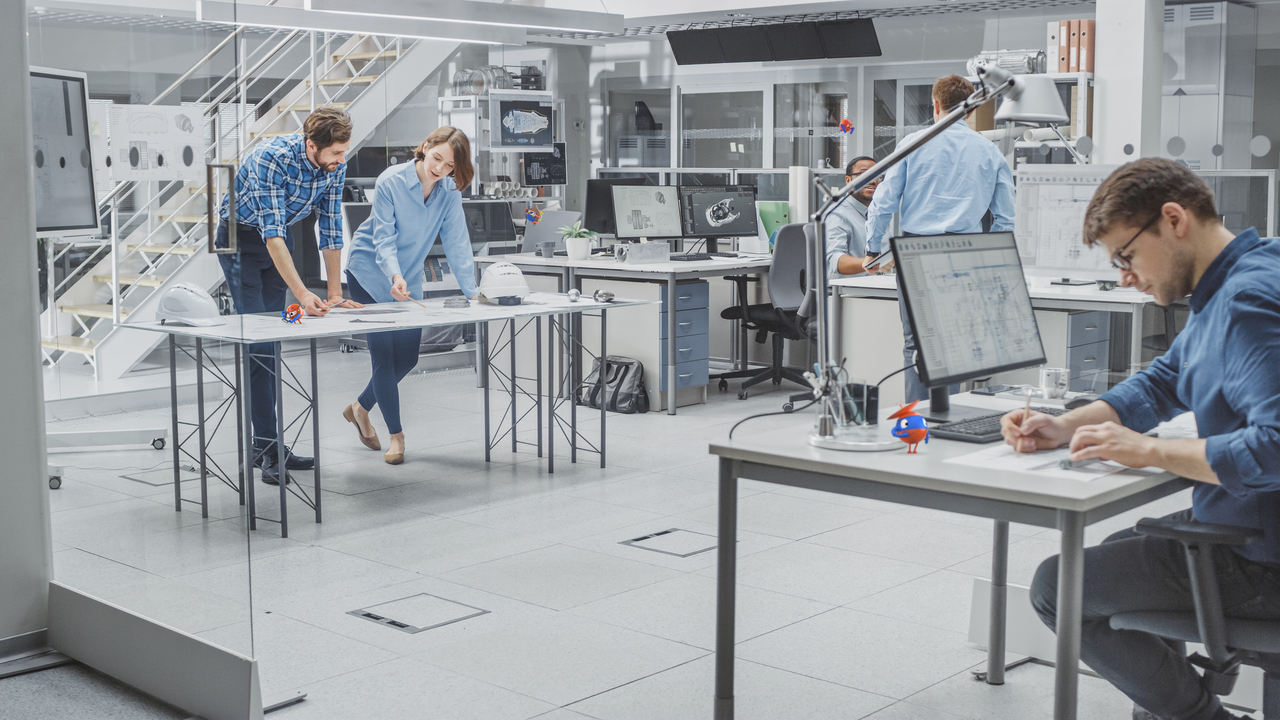 office workers in blue shirts in white office space