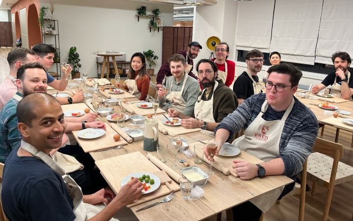 a photo of the Re:infer team at a social activity - cooking class