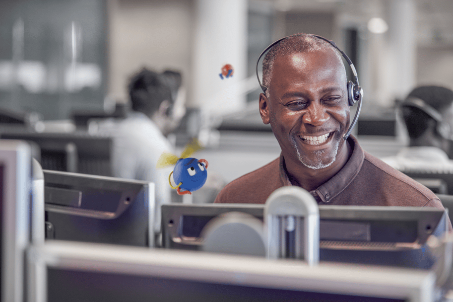 man smiling wearing a headset
