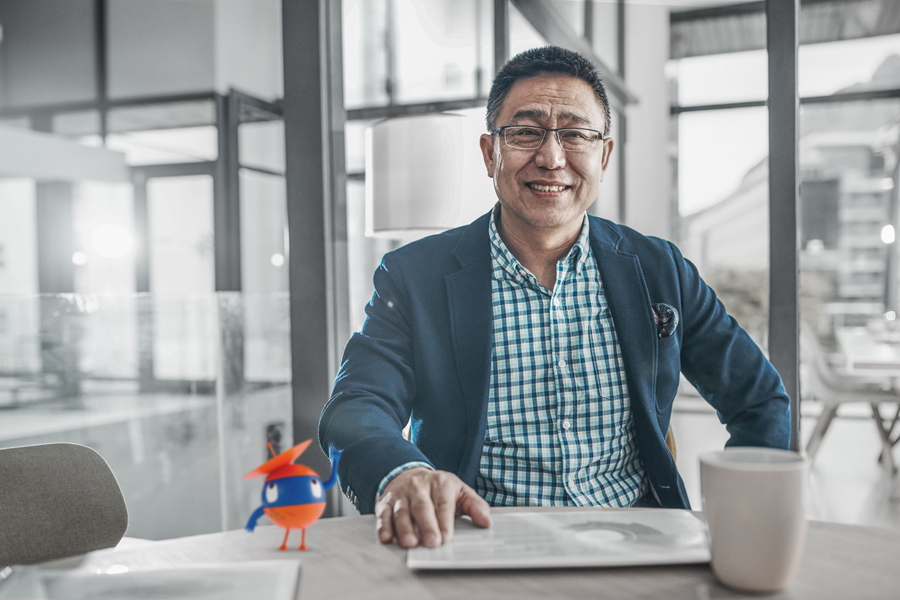 man sitting and smiling
