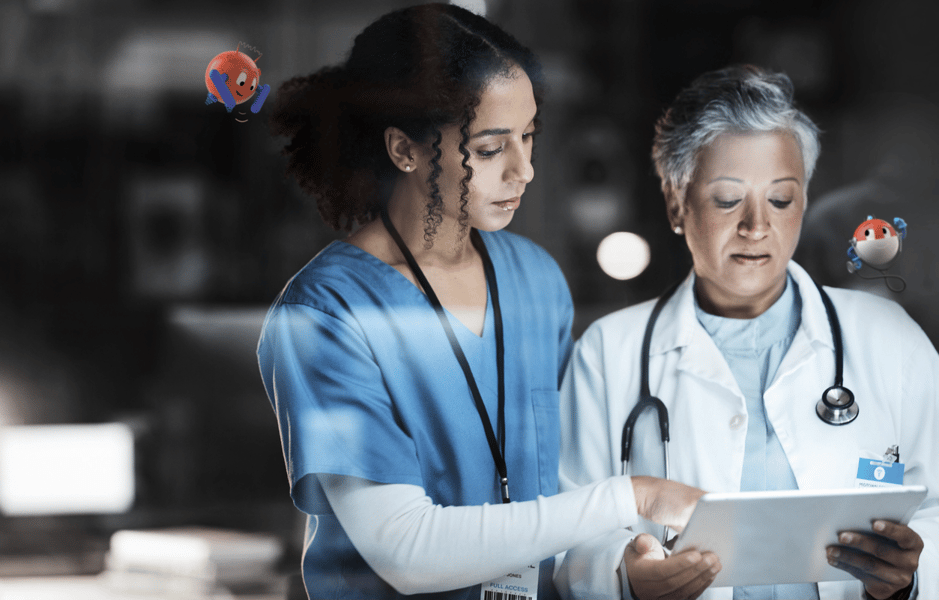 two medical professionals looking at a chart