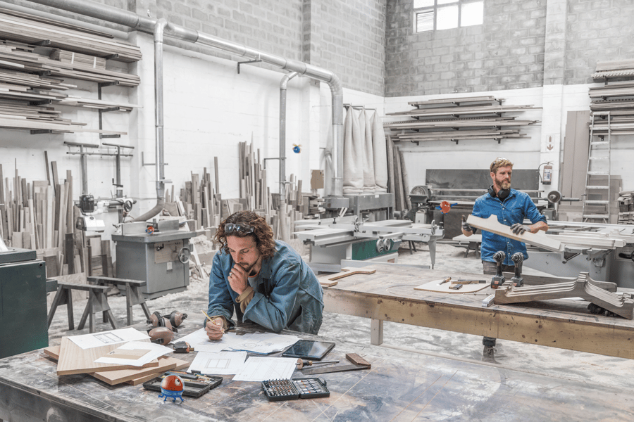 two men in a manufacturing space