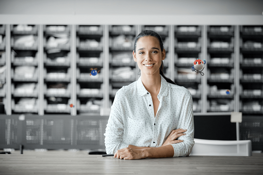 woman smiling with arms folded