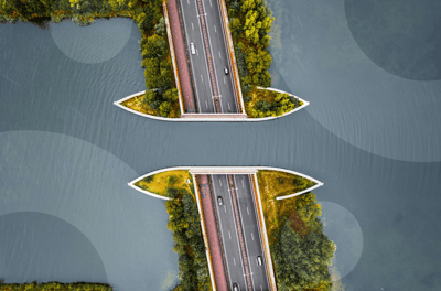roadway with cars surrounded by water