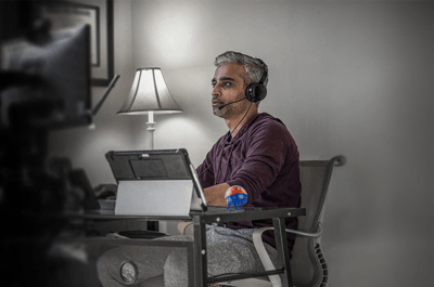 man sitting at a desk with a computer