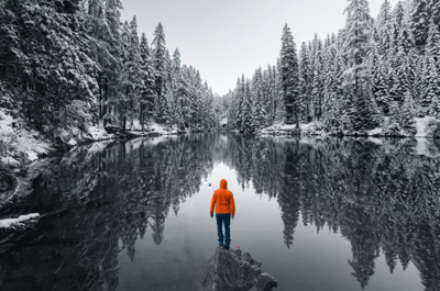 man standing in riverbank