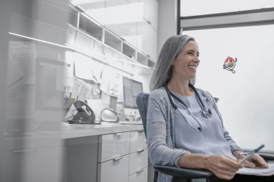 smiling woman with a stethoscope around her neck