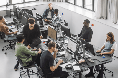 people sitting at desks and computers
