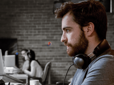 man sitting at a computer