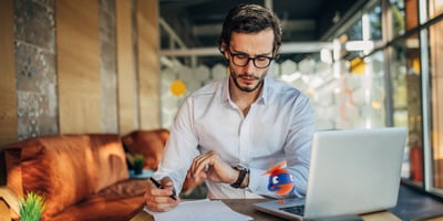 uipath robot assistant office setting man looking at watch