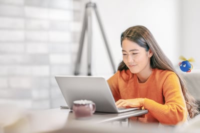 Image of a woman with her laptop
