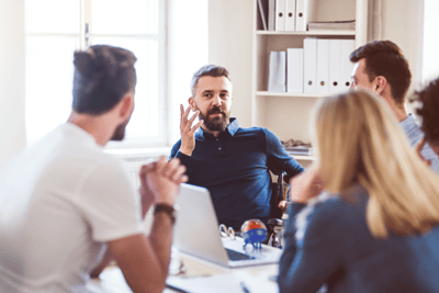 people sitting around a table talking