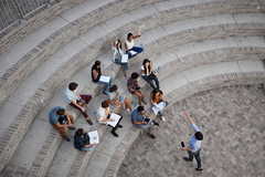 crowd of people sitting on steps
