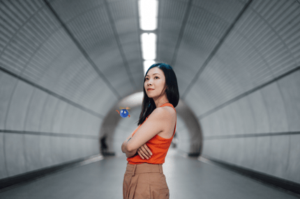 woman with arms folded in a tunnel