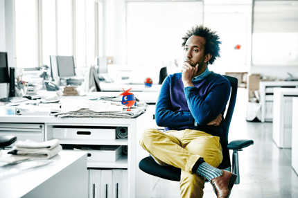 man sitting at desk