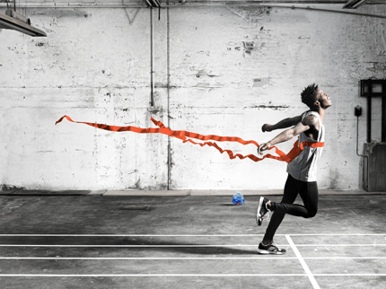 runner crossing a finish line