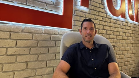 Lior Eldad near the UiPath logo