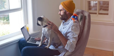 uipath robot assisting man working from home with dog