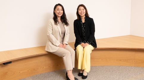 Eriko Murakami & Kiyoko Kikuchihara sitting on a bench