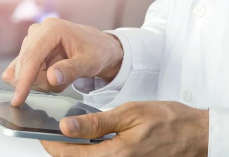 hands using a computer tablet